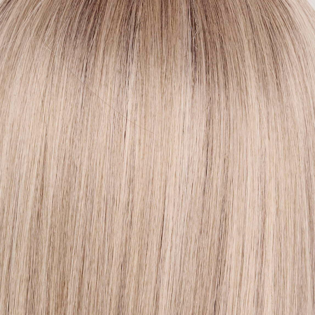 Billionaire Blond | A sophisticated hue featuring a rich mocha chocolate root that transitions into finely woven beige, ash, and cream blond tones. The face-framing luxurious cream and white blond highlights elevate the color, giving it an upscale, elegant appearance. This stunning blend exudes a high-end look that is both chic and refined.