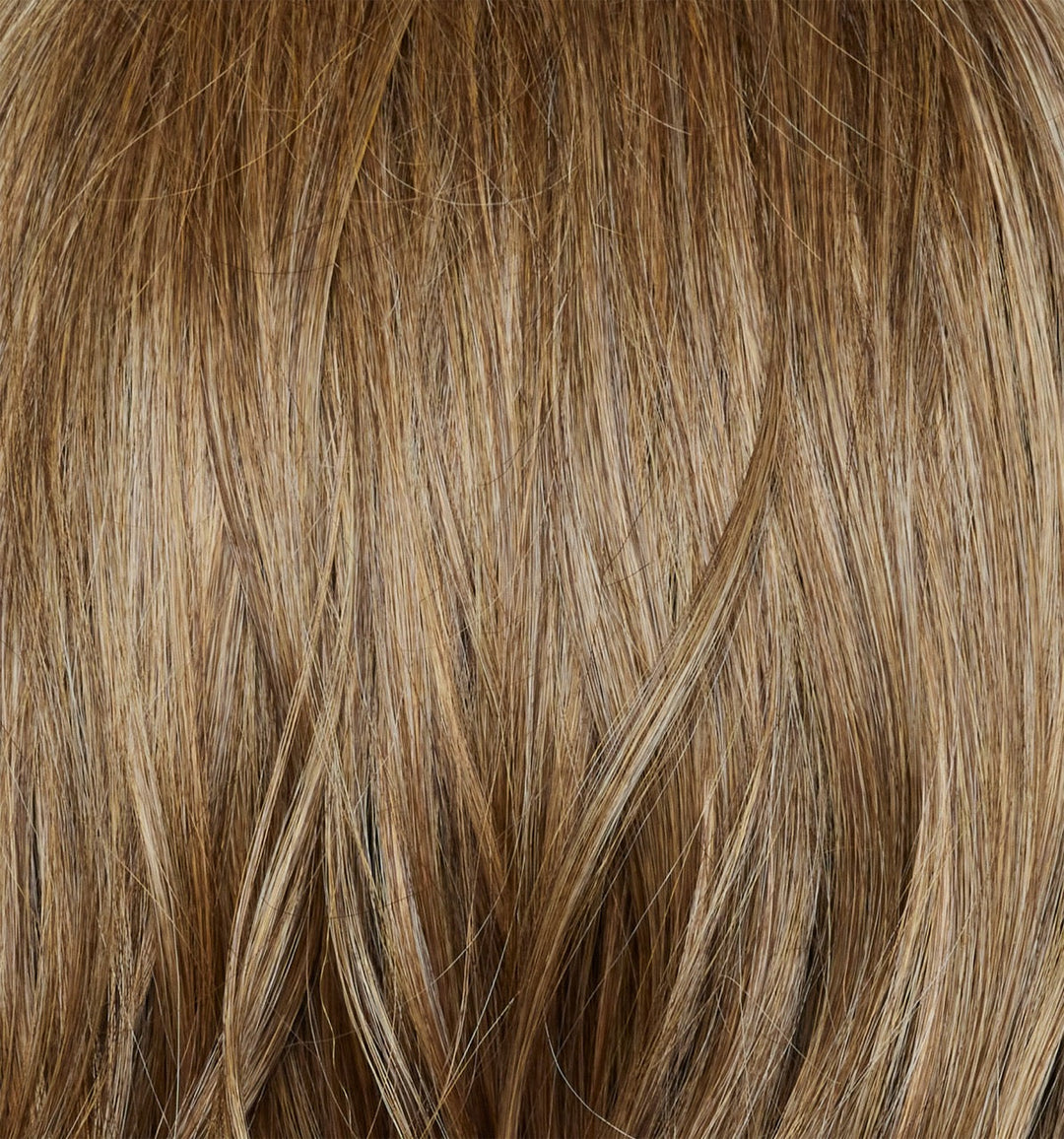 Caramel Biscotti | Caramel Biscotti is a beautiful mid/dark blond hair color with delicate caramel blond highlights seamlessly blended throughout, creating a warm and inviting look.