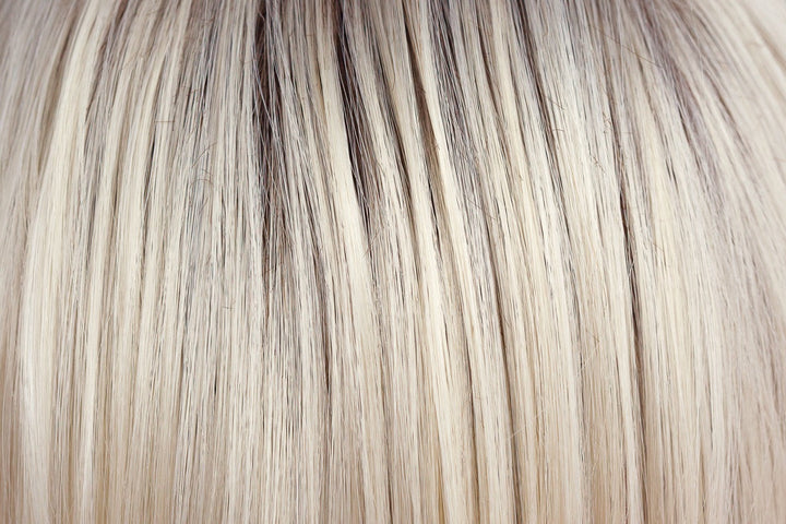 Coco Cream | A rich dark chocolate base that pushes the boundaries with its stunning displays of lily white chunky blond weaves and pale natural ash blond slices.