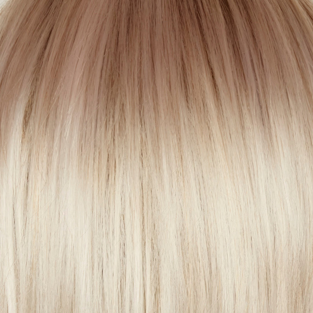 Ghost Blond-R | The rooted sister of the stunning hair color Ghost Blond. This color has a medium neutral blond root regrowth which transfers into a pearl cream blond. This exquisite shade is both versatile and flattering, suitable for both short and long hair styles. The unique platinum blond undertones give this color a distinctive and eye-catching appearance, making it a standout choice for those looking for a chic and sophisticated look.