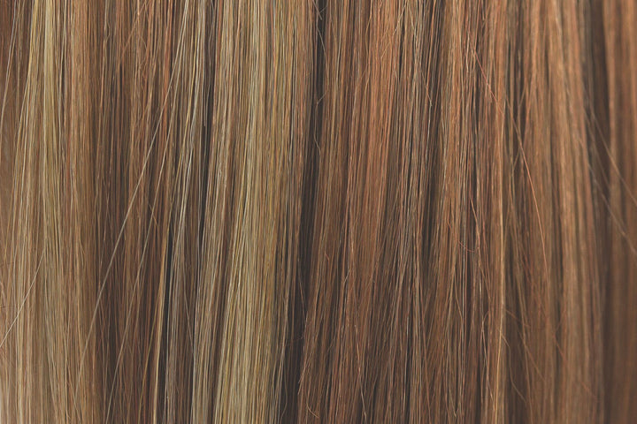 Ginger Snap | A highlighted and low-lighted color that has a rich coppery gold brown base, with many contrasting weaves of amber blond, cool coppers and ginger and pine undertones.