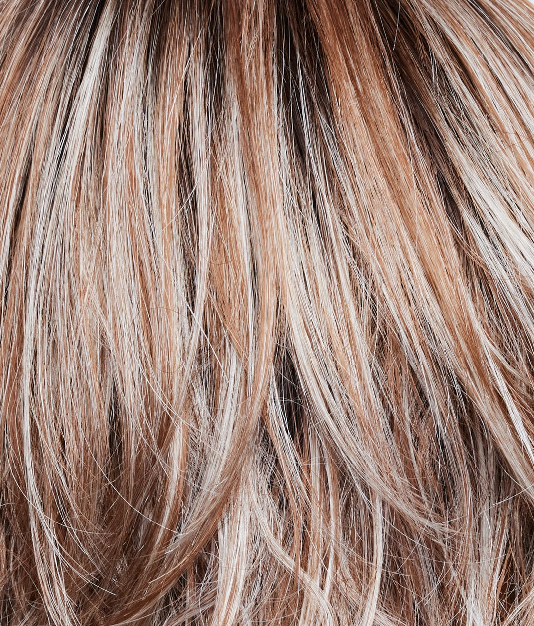 Melted Cinnamon | Melted Cinnamon is a medium-brown root tone that melts into the cinnamon blond base color. It's then topped off with icy blond ends.