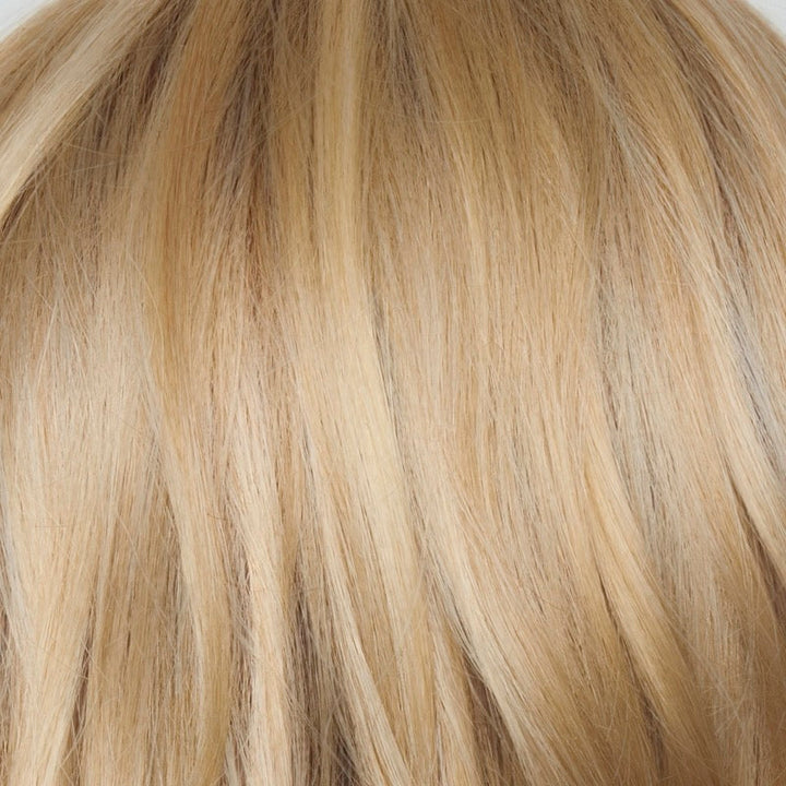 Sandy Cream Blond-R | This shade features soft golden sand tones with subtly rooted color for a natural regrowth effect. This blend of beige brown, honey, and creamy blonde transitions beautifully into lighter shades, creating a warm, versatile look that flatters any skin tone. A perfect choice for effortless, honey-warm blonde style.
