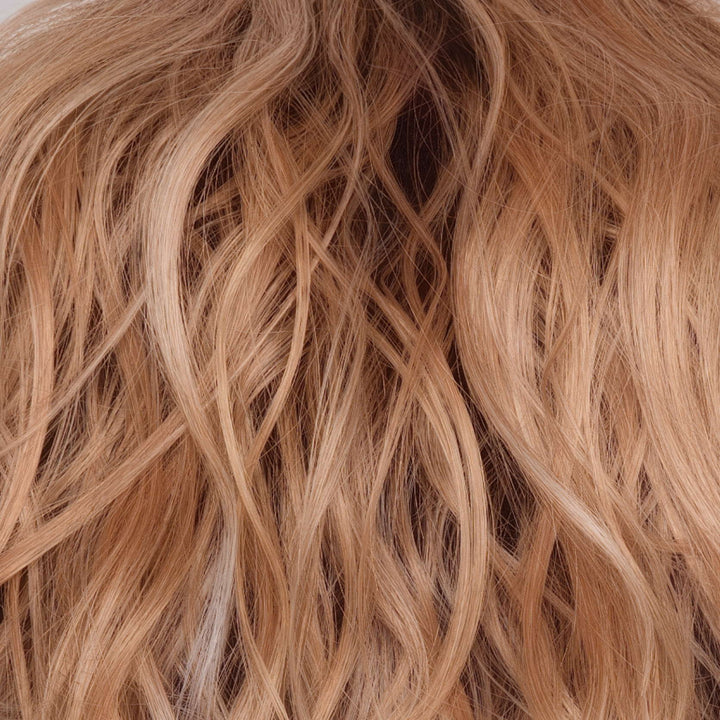 Peaches &amp; Cream | Features a warm peach blonde base with creamy blonde undertone highlights. Face-framing highlights in a bright cream white blonde enhance the look, while a rich chocolate root regrowth adds depth and contrast. This playful yet sophisticated color combination creates a vibrant and fresh look.