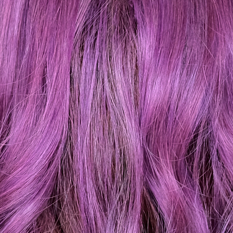 Purple Rain F11/118R+12 | Purple Rain is a deep, subdued monarch purple with an indigo undertone. It is a striking shade that exudes uplifting soulful energy. The root is a combination of light and medium brown, which continue as an undertone throughout the body. A beautiful mixture of violet, boysenberry, lavender, plum, and a hint of magenta creates a mystical and upscale color of purple rain.