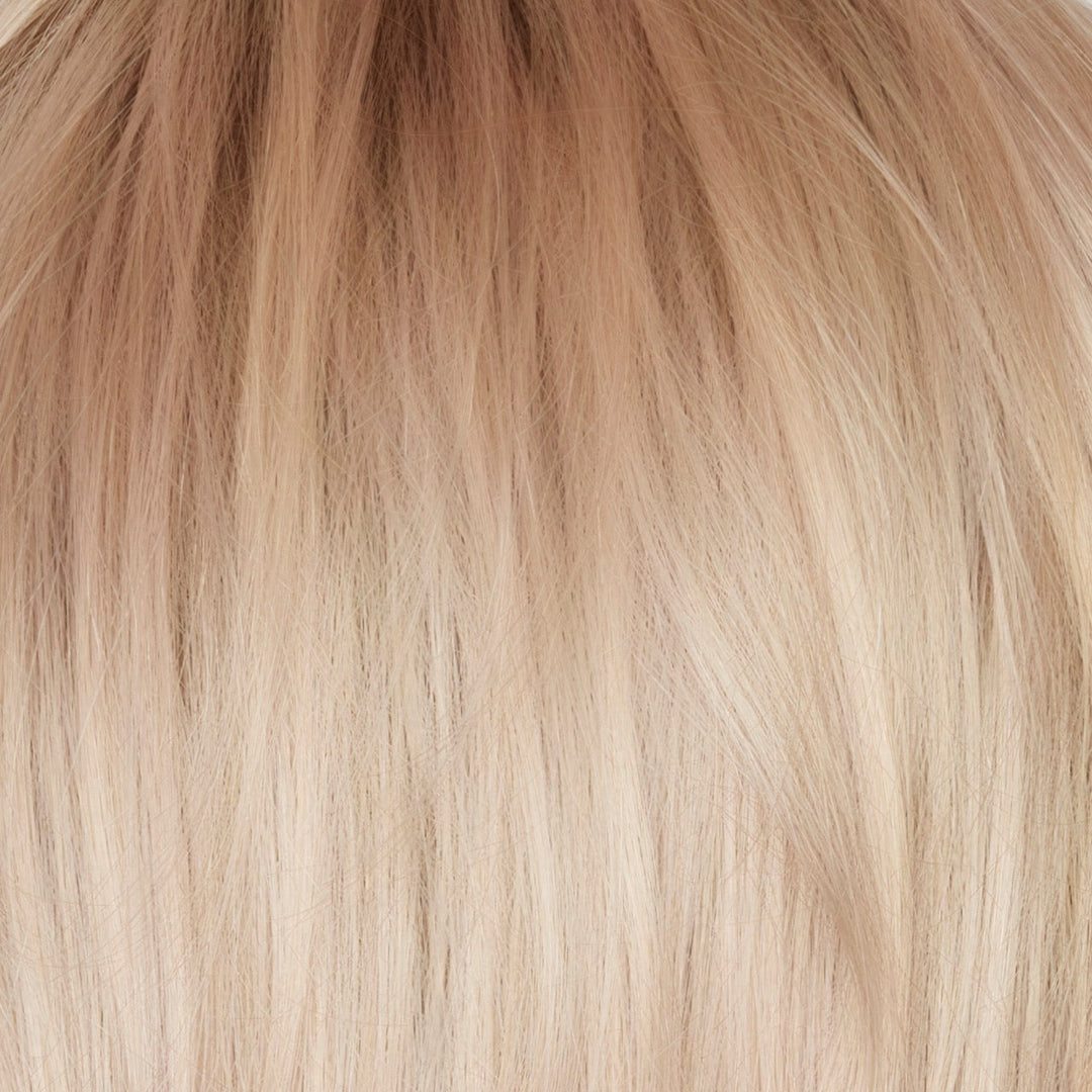 Snowy Peach-R | The rooted sister of Snowy Peach, Snowy Peach-R is a beautiful and unique hair color that combines pale peach and platinum blond tones this color has a medium neutral blond root regrowth, and is a refreshing and fashionable shade that is versatile and complements all skin tones. This color enhances the natural warmth of your skin, giving you a radiant and luminous look.