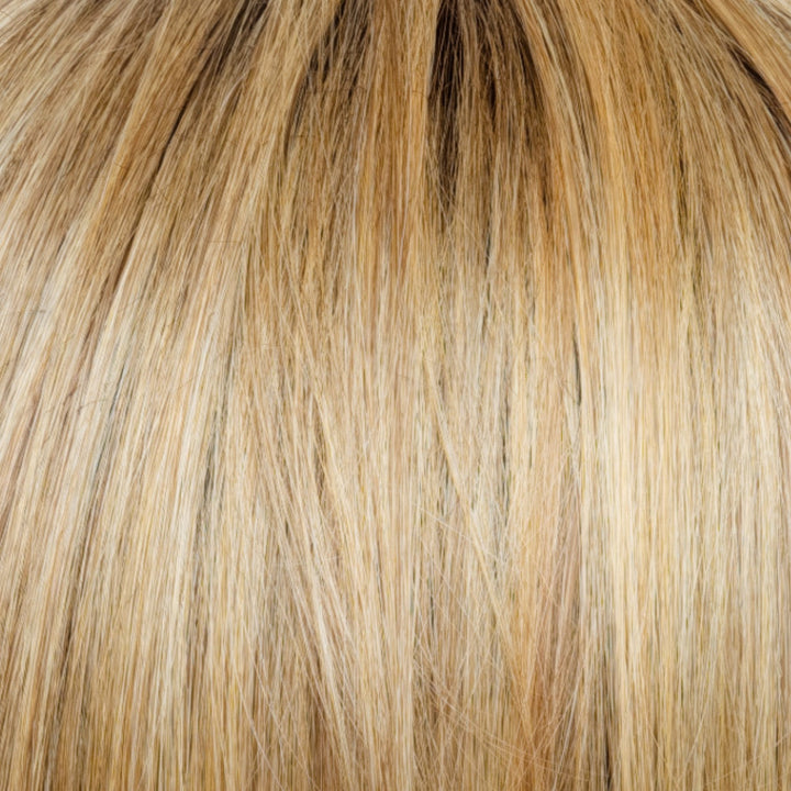 Cinder Toffee-R | This exquisite mid blonde shade is a work of art, featuring a harmonious blend of beige, brown burnt toffee, blonde, and gold highlights expertly woven throughout the hair. The root regrowth shade is a mid-brown that seamlessly transitions into the midlands and ends, creating a natural and fashion-forward hair color.