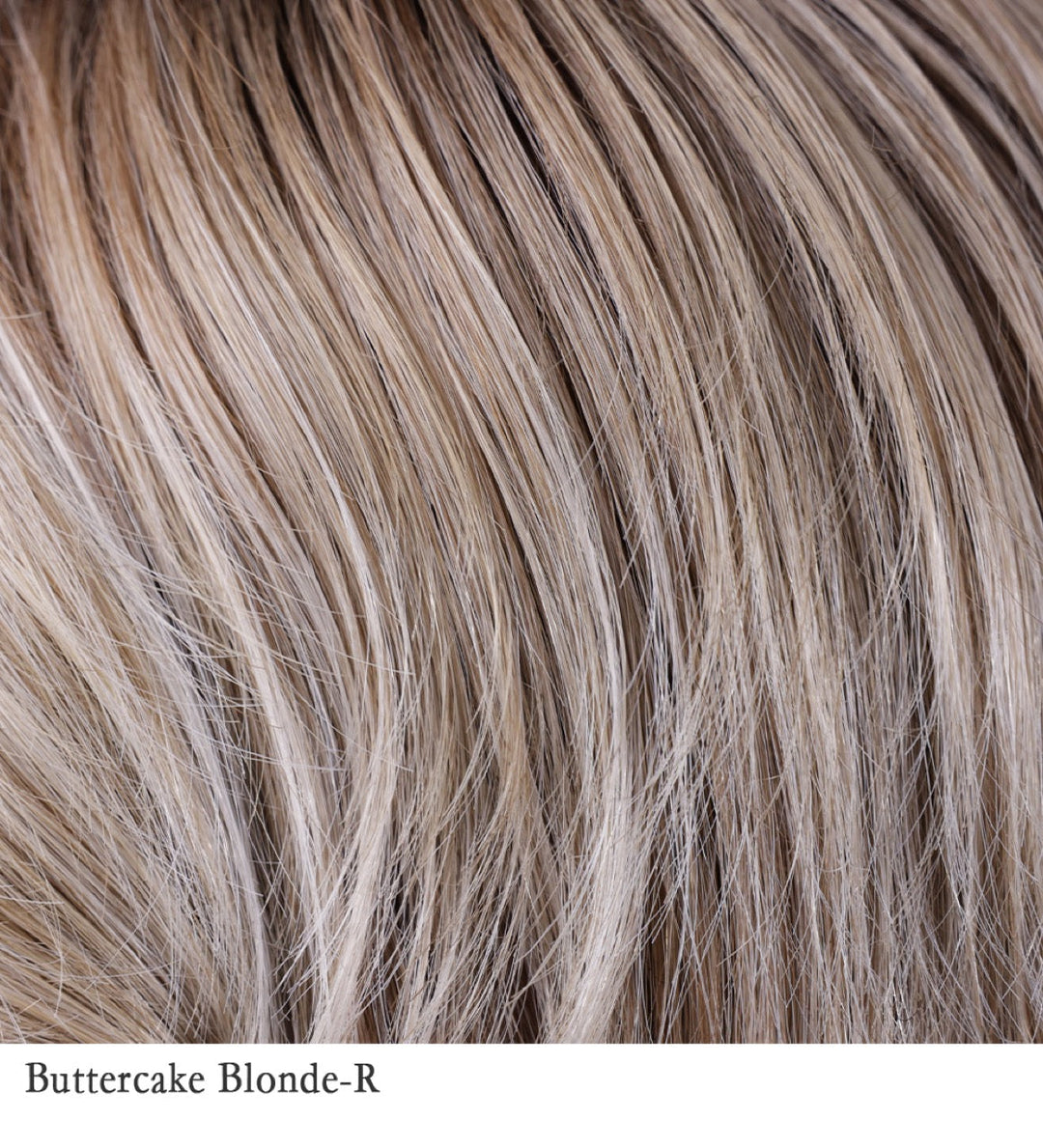 Buttercake Blonde-R 10/23/88+8 | This shade features a neutral to warm blend, combining tones of light brown (10), medium ash blonde (23), and lightest blonde (88), with darker roots (8). The result is a harmonious mix that offers depth and dimension, creating a natural-looking blonde with subtle warmth. The "R" denotes a rooted effect, where the darker roots appear realistic.