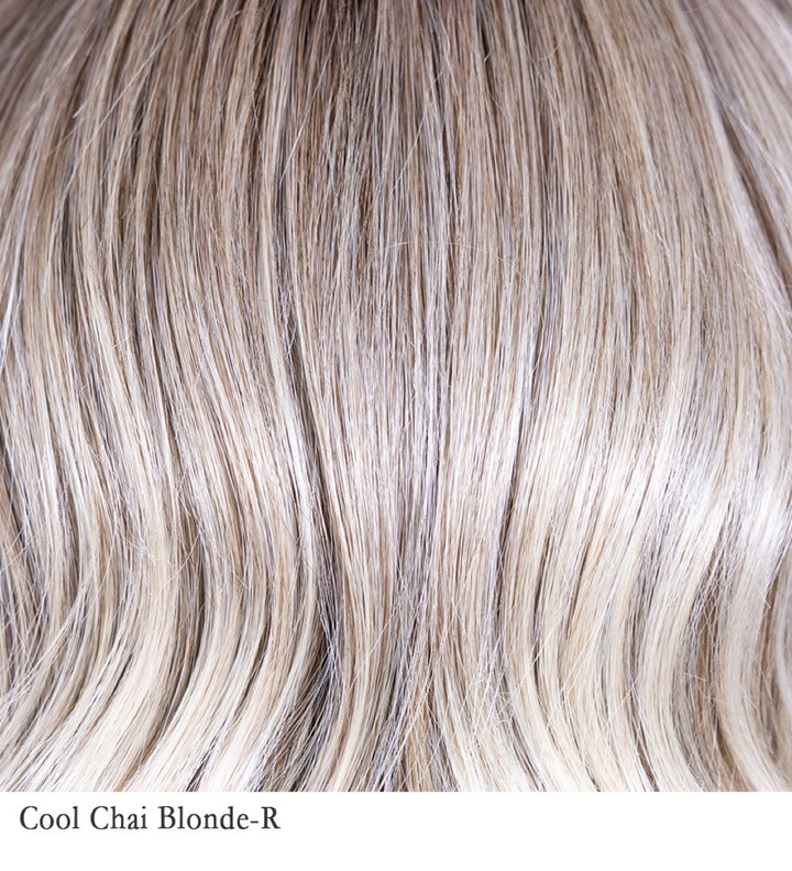 Cool Chai Blonde-R 10/17/23+8 | This versatile color complements various skin tones, offering a balanced coolness that brightens the complexion without appearing too warm. The subtle interplay between cool blonde lengths and the darker roots provides a chic and modern aesthetic, suitable for those seeking a fresh take on traditional blonde shades.