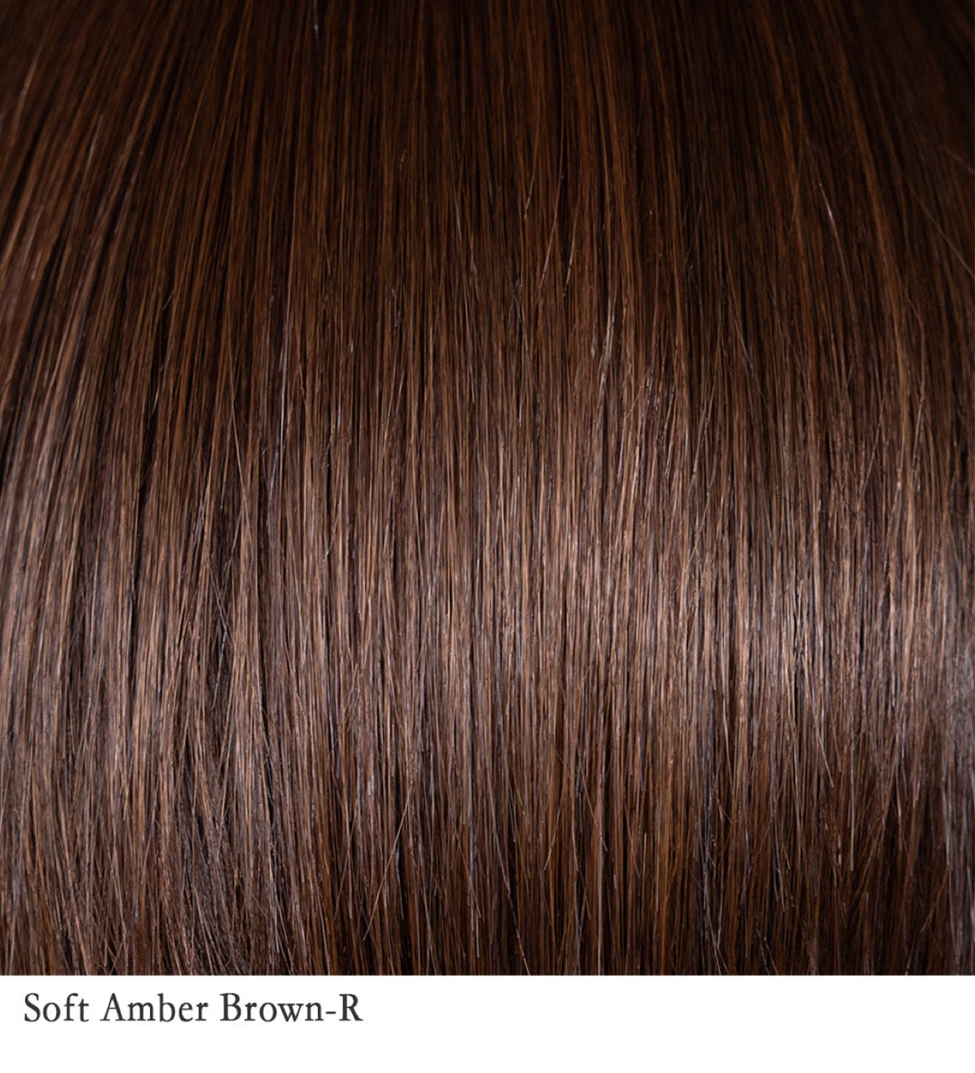Soft Amber Brown-R 6/33+4 | This shade combines warm amber tones—reminiscent of a blend of gold and red hues—with a medium brown base. The result is a rich, multidimensional color that adds warmth and depth to the hair. The rooted hair color features slightly darker roots, creating a natural, lived-in appearance and adding dimension to the overall look.