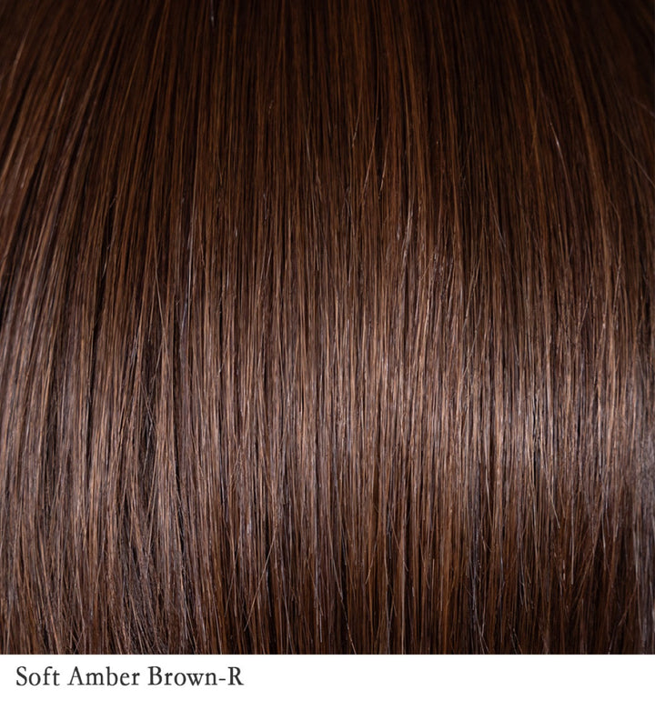 Soft Amber Brown-R 6/33+4 | This shade combines warm amber tones—reminiscent of a blend of gold and red hues—with a medium brown base. The result is a rich, multidimensional color that adds warmth and depth to the hair. The rooted hair color features slightly darker roots, creating a natural, lived-in appearance and adding dimension to the overall look.