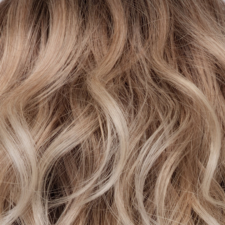 Melted Sand | Rich, warm brown root melts into the neutral blond tone. Light-beige blond ends complete this stunning color.